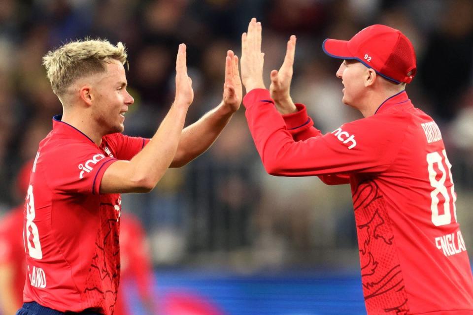 In the money: England duo Sam Curran and Harry Brook went for big money at the latest IPL auction on Friday  (AFP via Getty Images)