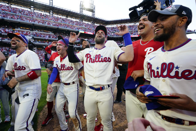 The Philadelphia Phillies' Chase Utley celebrates with Jimmy