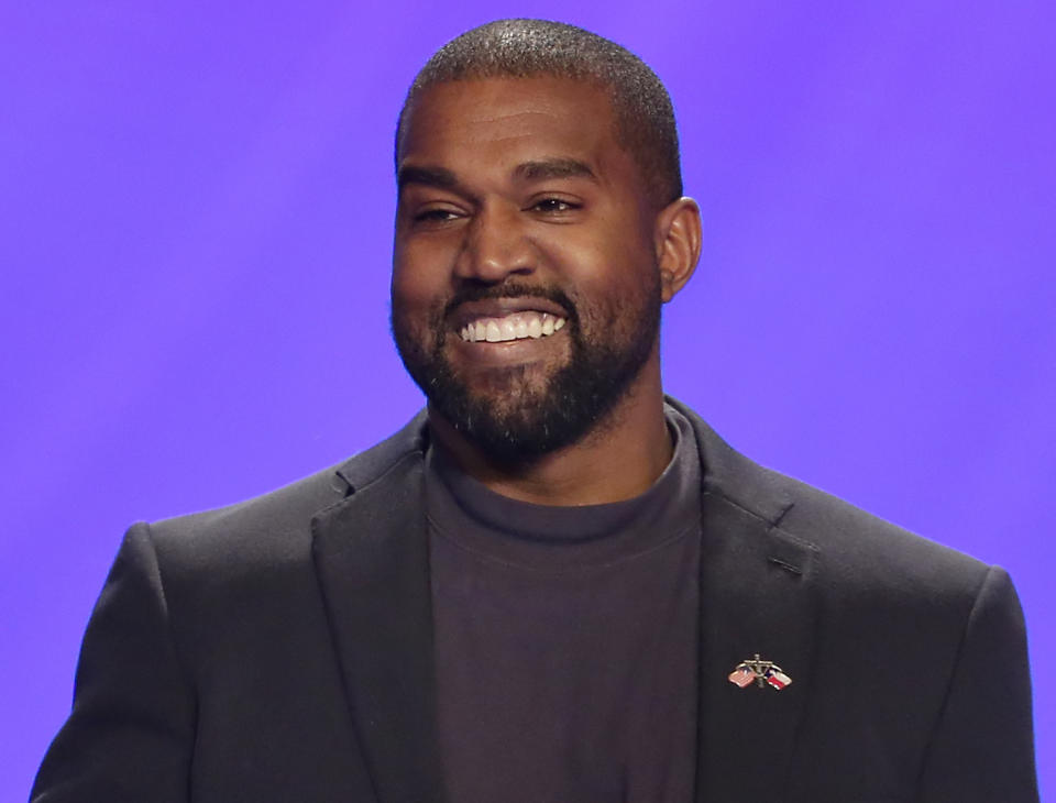 FILE - This Nov. 17, 2019, file photo shows Kanye West on stage during a service at Lakewood Church in Houston. The government's small business lending program has benefited millions of companies, with the goal of minimizing the number of layoffs Americans have suffered in the face of the coronavirus pandemic. Yet the recipients include many you probably wouldn't have expected. West’s clothing-and-sneaker brand Yeezy received a loan of between $2 million and $5 million, according to the data released by Treasury. The company employed 106 people in mid-February before the pandemic struck. (AP Photo/Michael Wyke, File)