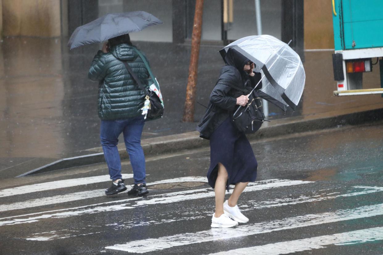 <span>People walk in wet weather in Sydney. Parts of NSW will see heavy rainfall from Thursday, the BoM says, as a high pressure system over Australia’s south-east crosses paths with an inland low.</span><span>Photograph: Rex/Shutterstock</span>