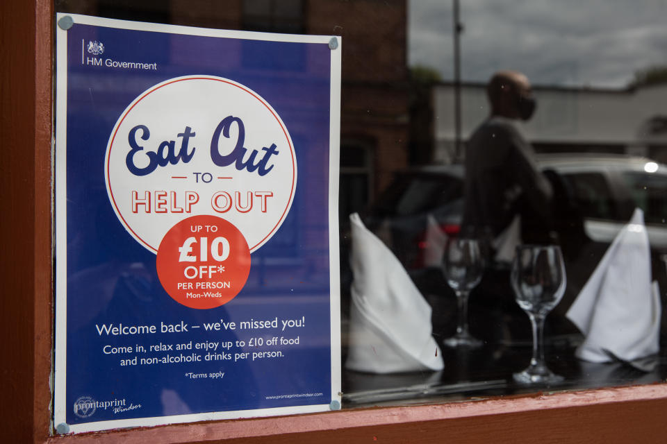 An Eat Out To Help Out poster in a restaurant window. Photo: Mark Kerrison/In Pictures via Getty Images