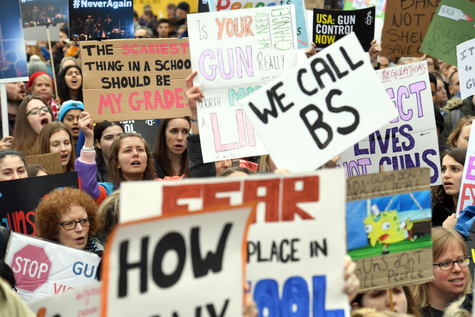 <p>Protesters march in the London March For Our Lives anti-gun rally outside the U.S. Embassy in London. (Photo: Stefan Rousseau/PA Wire) </p>