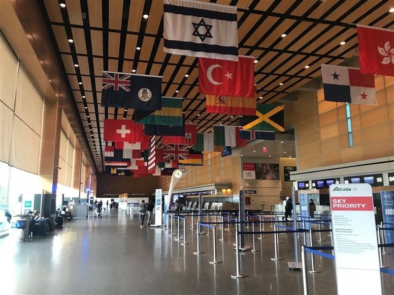 Few passengers dot the international terminal at Boston Logan International Airport on Thursday, March 12, 2020, amid the coronavirus chaos.