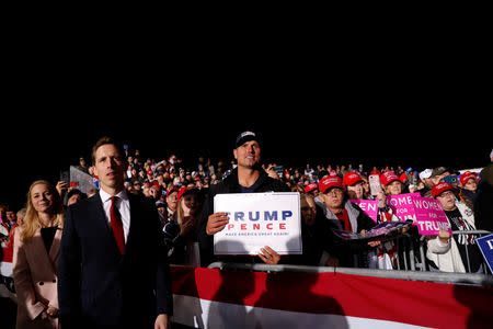 Supporters watch as U.S. President Donald Trump holds a campaign rally at the Columbia Regional Airport in Columbia, Missouri, U.S., November 1, 2018. REUTERS/Carlos Barria