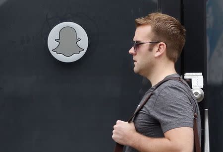 A man walks past Snapchat's headquarters in Venice, Los Angeles California October 13, 2014. REUTERS/Lucy Nicholson