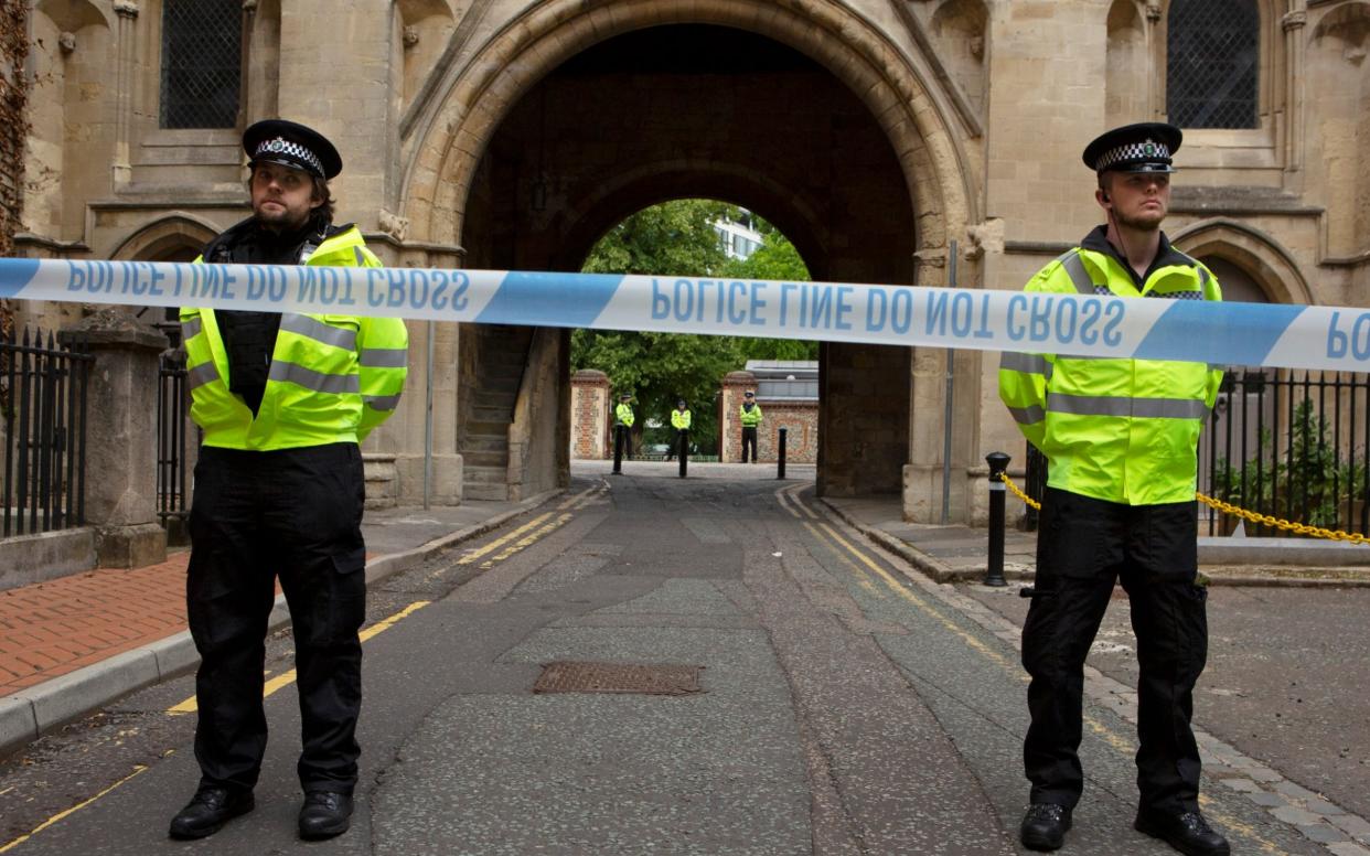 Police officers guard the Abby Gate entrance to Forbury Gardens in Reading - Tom Pilston