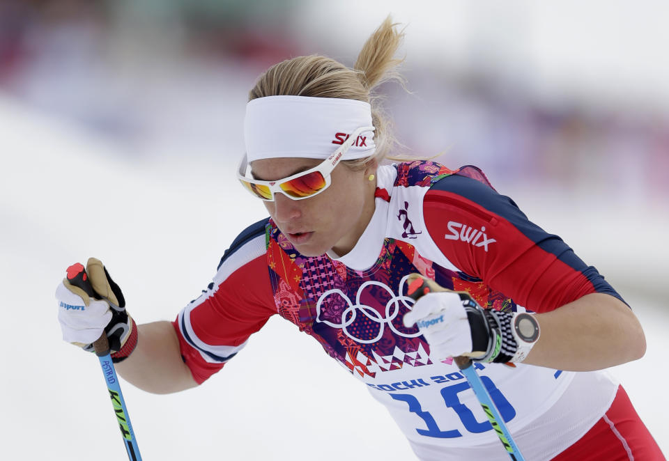 Norway's Astrid Uhrenholdt Jacobsen starts the women's qualification of the cross-country sprint at the 2014 Winter Olympics, Tuesday, Feb. 11, 2014, in Krasnaya Polyana, Russia. (AP Photo/Matthias Schrader)