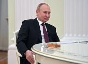 Russian President Vladimir Putin listens to Iranian President Ebrahim Raisi during their meeting in the Kremlin in Moscow, Russia, Wednesday, Jan. 19, 2022. (Pavel Bednyakov/Sputnik, Kremlin Pool Photo via AP)