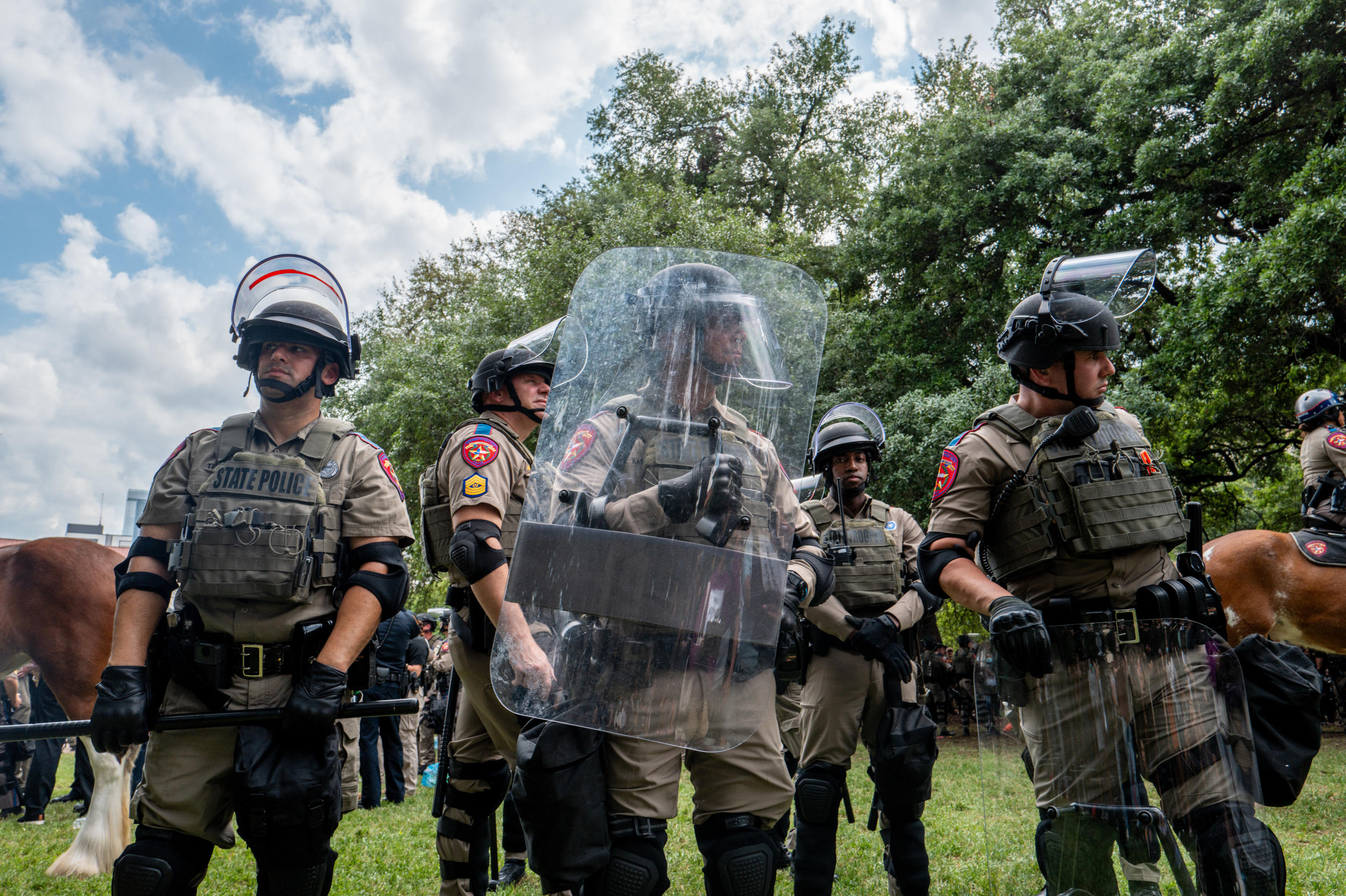 Police personnel stand by during a demonstration at the The University of Texas at Austin.