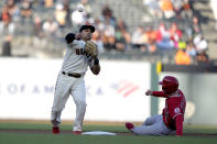 San Francisco Giants second baseman Donovan Solano, left, throws to first base for a double play after forcing out Los Angeles Angels' Phil Gosselin (13) during the first inning of a baseball game Tuesday, June 1, 2021, in San Francisco. Anthony Rendon was out at first. (AP Photo/Tony Avelar)