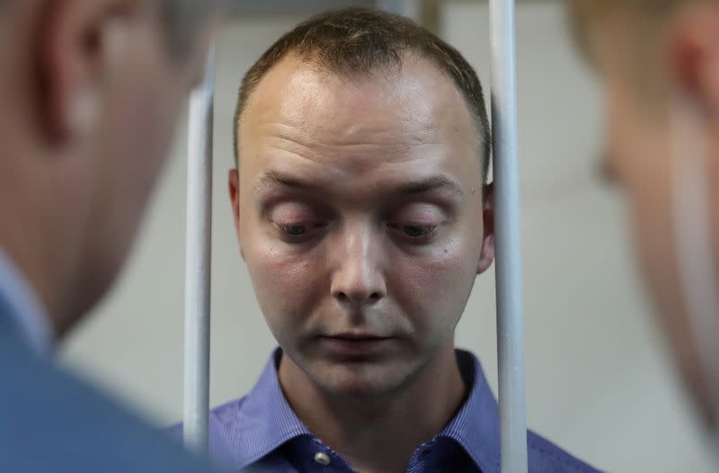 FILE PHOTO: Ivan Safronov, a former journalist who works as an aide to the head of Russia's space agency Roscosmos, detained on suspicion of treason, attends a court hearing in Moscow