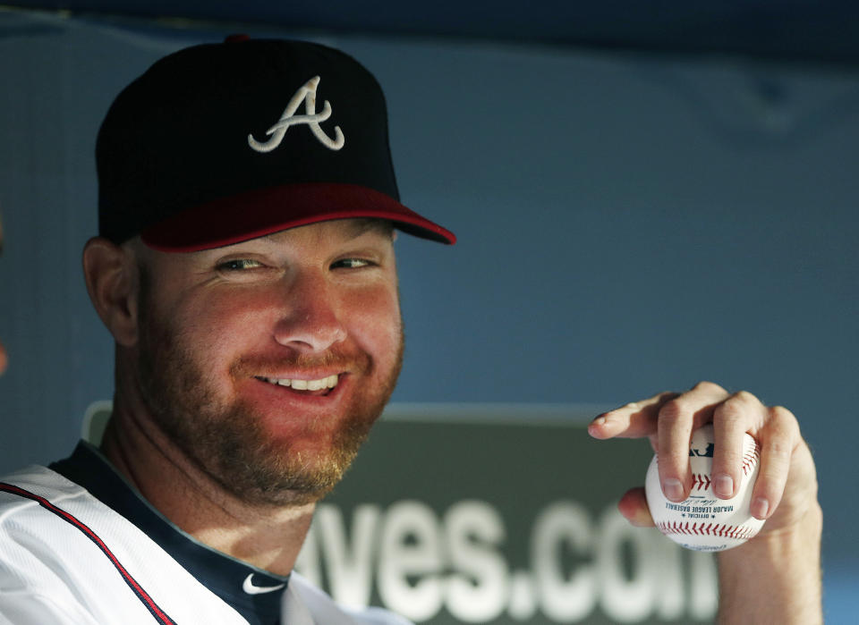 FILE - Atlanta Braves relief pitcher Jonny Venters sits on the bench during a baseball game against the Miami Marlins in Atlanta, Monday, July 21, 2014. Pitchers can look to Jonny Venters as they return from a second operation to repair a torn elbow ligament: He made it back to the big leagues after what he calls 3 1/2 Tommy John procedures. (AP Photo/John Bazemore, File)