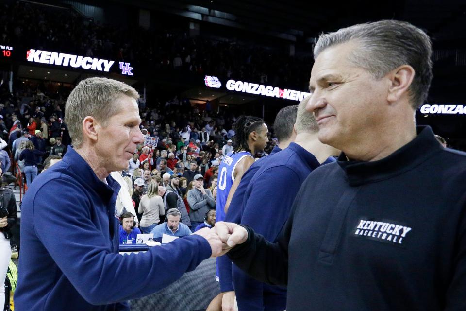 Gonzaga coach Mark Few, left, and Kentucky coach John Calipari are scheduled to square off in February at Rupp Arena.