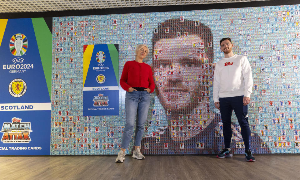 Andy Robertson at the unveiling of the mosaic depicting the Scotland captain using playing cards, courtesy of renowned artist Helen Marshall (left)