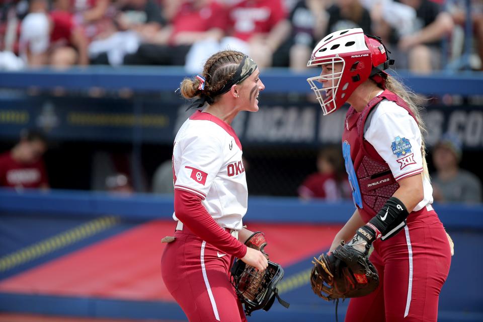 OU's Jordy Bahl (98) and Kinzie Hansen (9) celebrate after an out in a 2-0 win against Stanford on June 1 in the Women's College World Series at USA Softball Hall of Fame Stadium.