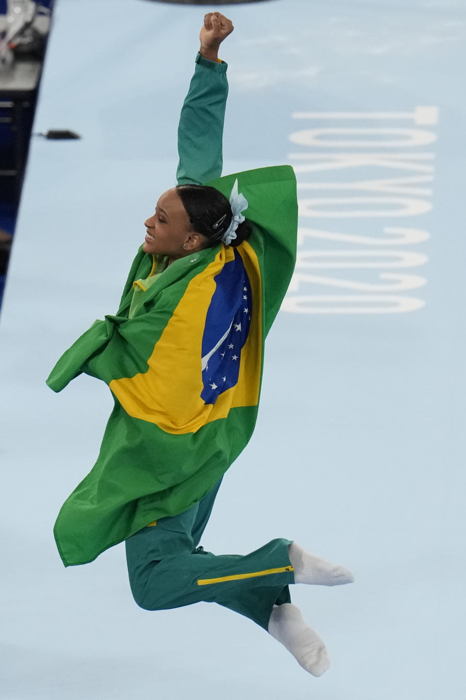 Rebeca Andrade of Brazil, celebrates after winning the gold medal on the vault during the artistic gymnastics women's apparatus final at the 2020 Summer Olympics, Sunday, Aug. 1, 2021, in Tokyo, Japan. (AP Photo/Gregory Bull)