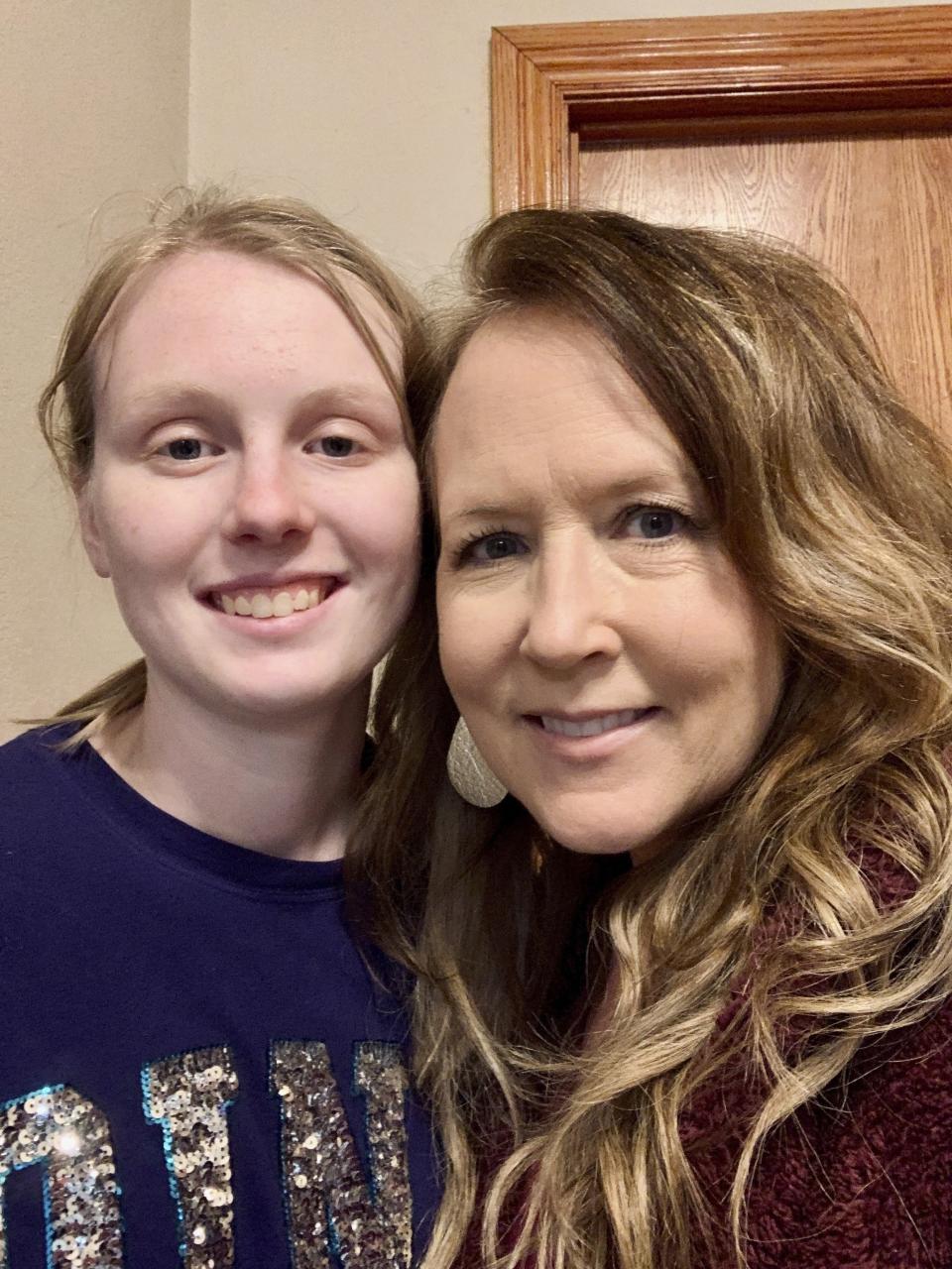 Brenda Keith, right, and her foster daughter, Alexus, pose for a photo on March 21, 2022, in Mansfield, Mo. States have for decades been using foster children's federal Social Security benefits to help cover the costs of state services. The practice has saved states millions of dollars. But that's beginning to change in some states under pressure from child advocates who contend it is immoral and detrimental to kids. (Brenda Keith via AP)