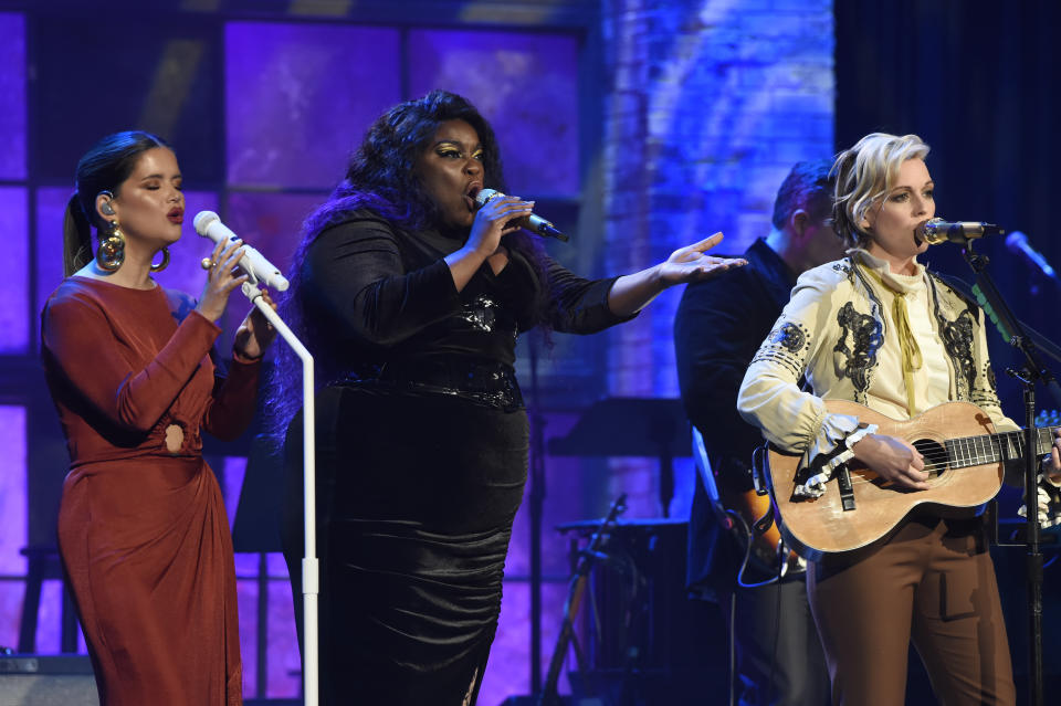 Maren Morris, left, and Brandi Carlile, right, of the Highwomen, are joined by Yola, center, during a performance at the Americana Honors & Awards show Wednesday, Sept. 22, 2021, in Nashville, Tenn. (AP Photo/Mark Zaleski)