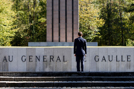 FILE PHOTO: French President Emmanuel Macron stands in front of the Croix de Lorraine during a visit at the Charles de Gaulle Memorial to mark the 60th anniversary of the French Constitution, in Colombey-les-Deux-Eglises, France, October 4, 2018. REUTERS/Vincent Kessler//File Photo