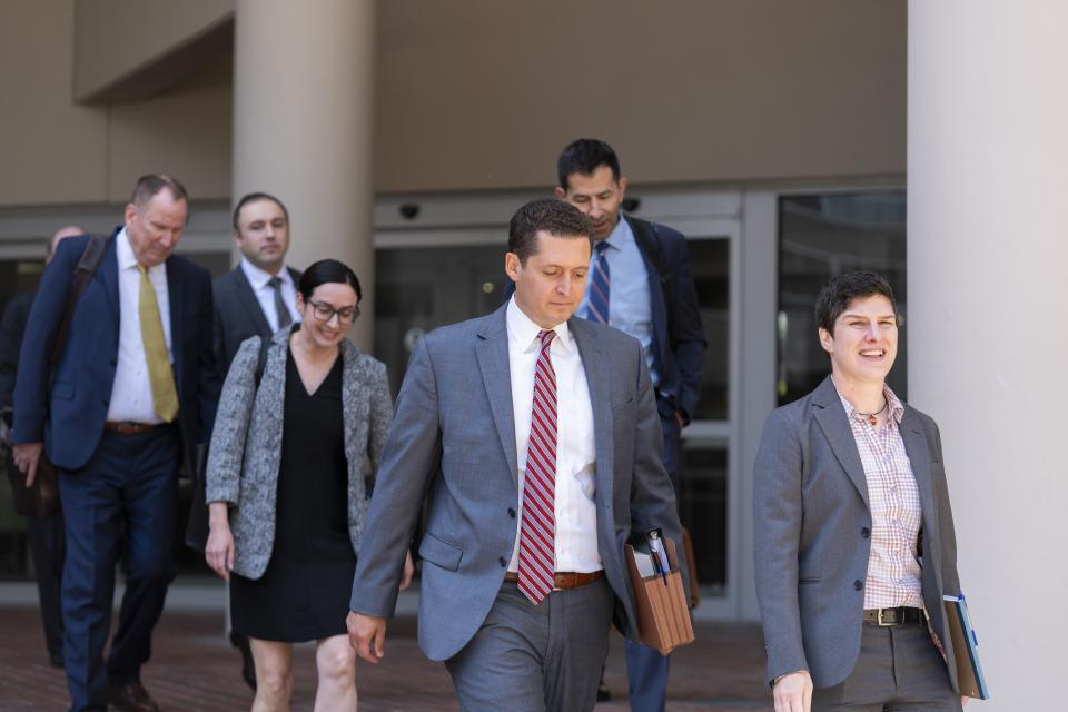 Department of Justice attorneys leave the Edward A. Garmatz United States District Courthouse in Baltimore, Thursday, June 20, 2024. (AP Photo/Stephanie Scarbrough)