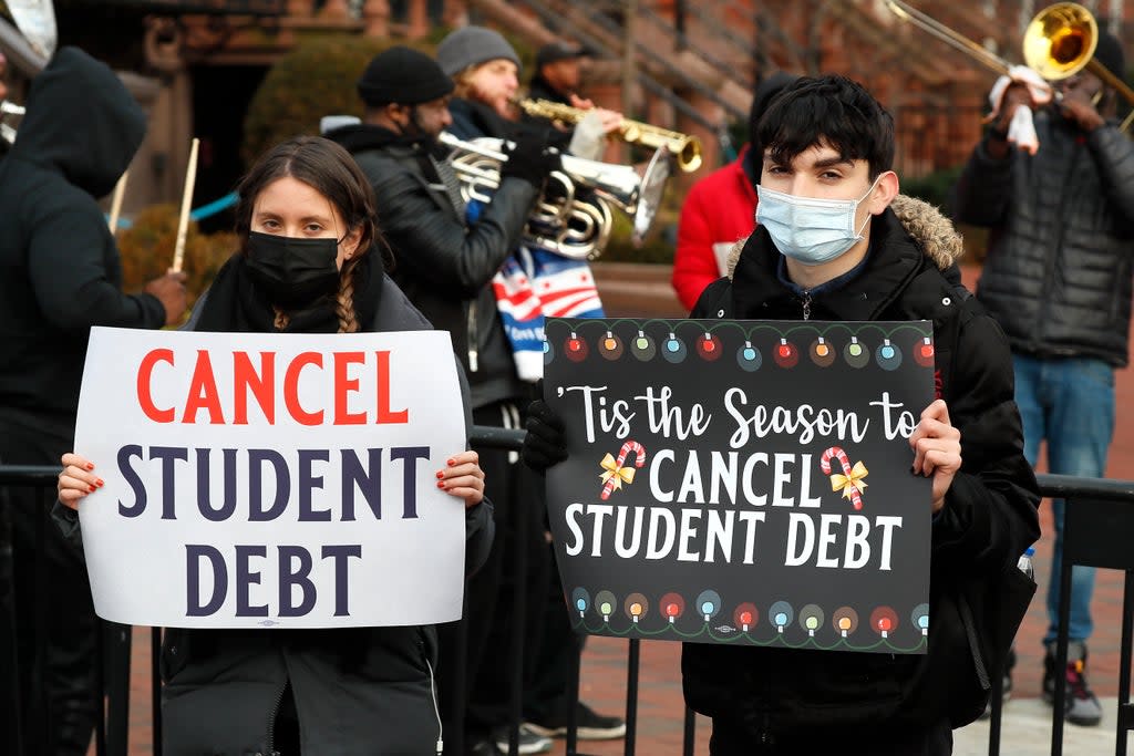 Advocates for student loan debt cancellation rallied outside the White House on 15 December. Joe Biden has extended a pause on repayments until May.  (Getty Images for We, The 45 Mill)