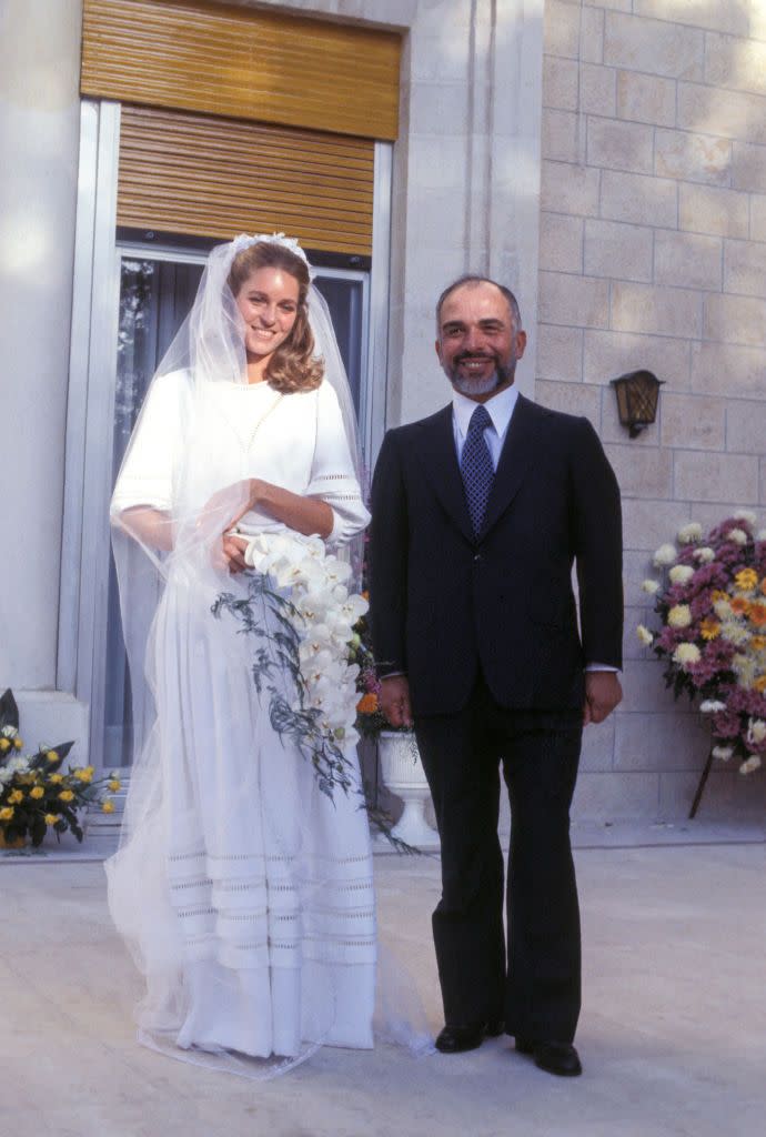 <p>Queen Noor (neé Lisa Halaby) married the King of Jordan in an understated four-tier dress by Christian Dior. </p>