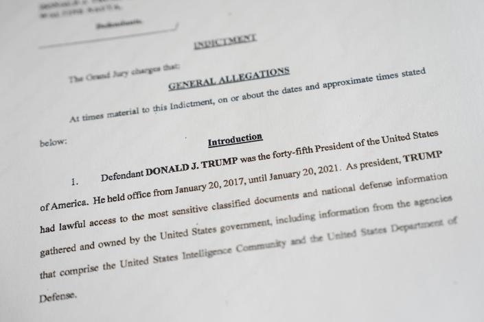 A photo shows a copy of the indictment of former President Donald Trump and Trump aide Waltine Nauta, brought by the United States Justice Department. Former President Trump was charged with multiple counts in a 49 page indictment.