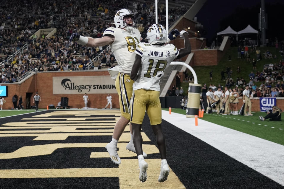 Georgia Tech wide receiver Abdul Janneh (18) celebrates his touchdown catch against Wake Forest with Luke Benson (81) during the first half of an NCAA college football game in Winston-Salem, N.C., Saturday, Sept. 23, 2023. (AP Photo/Chuck Burton)