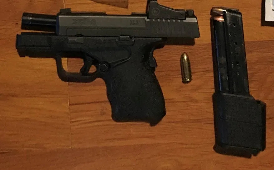 A gun that the Buncombe County Sheriff's Office says was seized from a Leicester home, along with 1.1 pounds of fentanyl and $1,136.