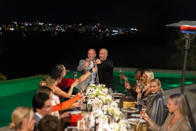 <p>Sara Mally/Netflix</p> Jason and Brett Oppenheim share a toast with the 'Selling Sunset' cast on season 7