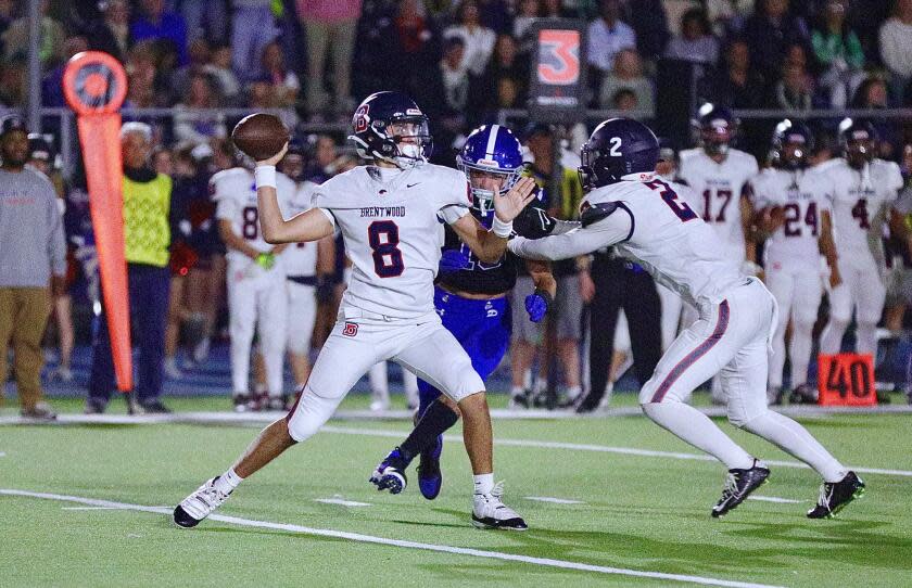 Brentwood sophomore quarterback Ben Mikail throws a pass from the pocket against Palisades.