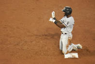 Chicago White Sox's Tim Anderson reacts after hitting a two-run double against the Baltimore Orioles during the sixth inning of a baseball game, Friday, July 9, 2021, in Baltimore. White Sox's Andrew Vaughn and Gavin Sheets scored on the double. (AP Photo/Julio Cortez)