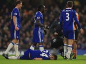 <p>Cahill is hurt as part of the collision </p>