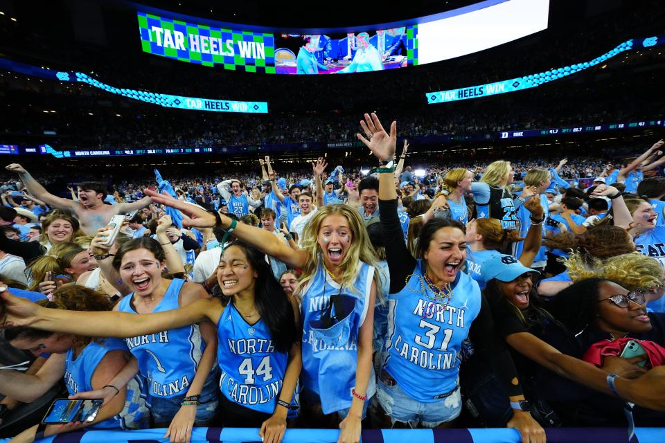 Tar Heels fans celebrate after defeating the Blue Devils during the Final Four at Caesars Superdome.
