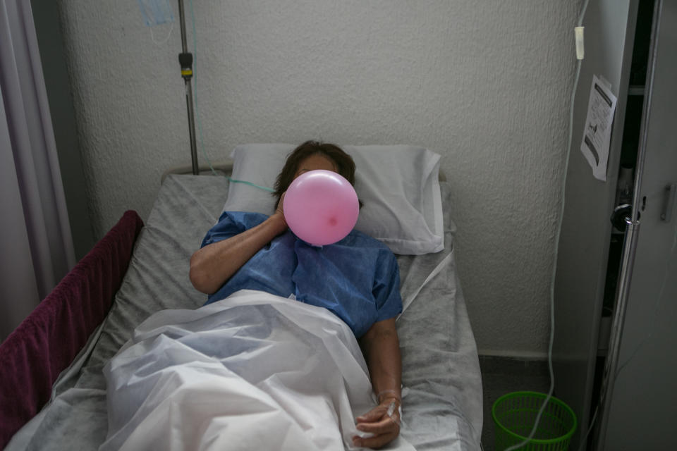 A patient uses a balloon to strengthen her lungs as she recovers from the coronavirus at a makeshift hospital in Mexico City, June 30, 2020. Lockdowns and supply-chain disruptions amid the coronavirus pandemic threaten progress against tuberculosis as well as HIV and malaria. (Meghan Dhaliwal/The New York Times)                                                                                                                                                                                                                                                                                                                                                                                              