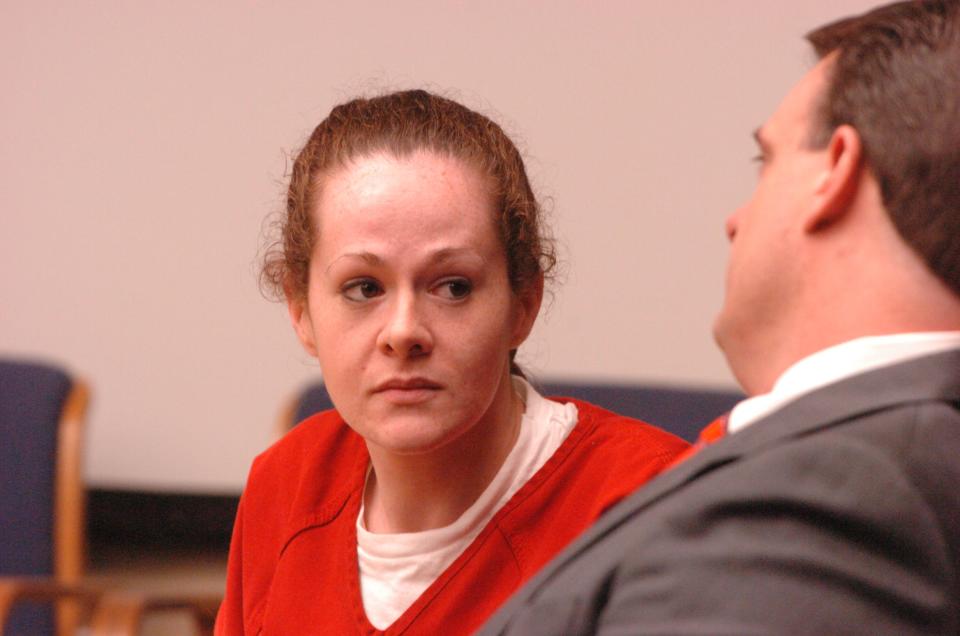 Convicted killer Christa Gail Pike talks with defense attorney James Crowson before the start of proceedings Friday, April 11, 2008 in Knox County Criminal Court. Pike was in court for a fifth day as her defense team continues a bid for a new trial in the 1995 killing of fellow job corps student Colleen Slemmer.  