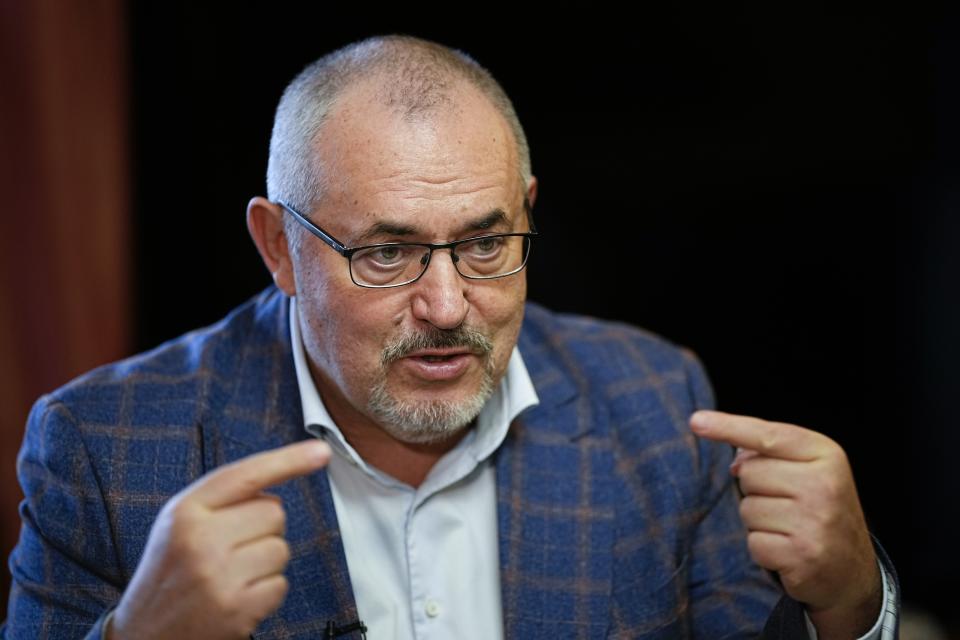 Boris Nadezhdin, a liberal Russian politician, center, who is seeking to run in the March 17 presidential election, gestures while speaking in an interview with The Associated Press in Moscow, Russia, Wednesday, Jan. 24, 2024. "I personally know Putin," he said, saying he met him before he became president in 2000. (AP Photo/Alexander Zemlianichenko)