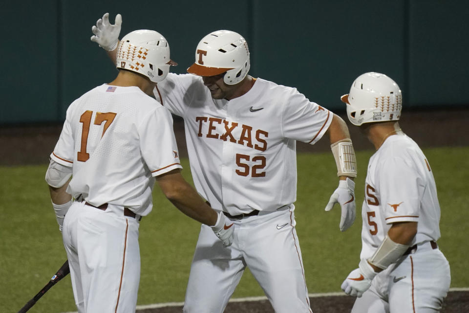 Texas' Zach Zubia (52) celebrates with teammates after hitting a two-run home run against Arizona State in the fourth inning of an NCAA college baseball tournament regional game Saturday, June 5, 2021, in Austin, Texas. (AP Photo/Eric Gay)