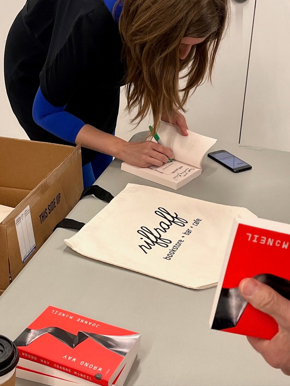 Author Joanne McNeil signs copies of "Wrong Way" at a Nov. 2023 book reading at the Fall River Museum of Contemporary Art.