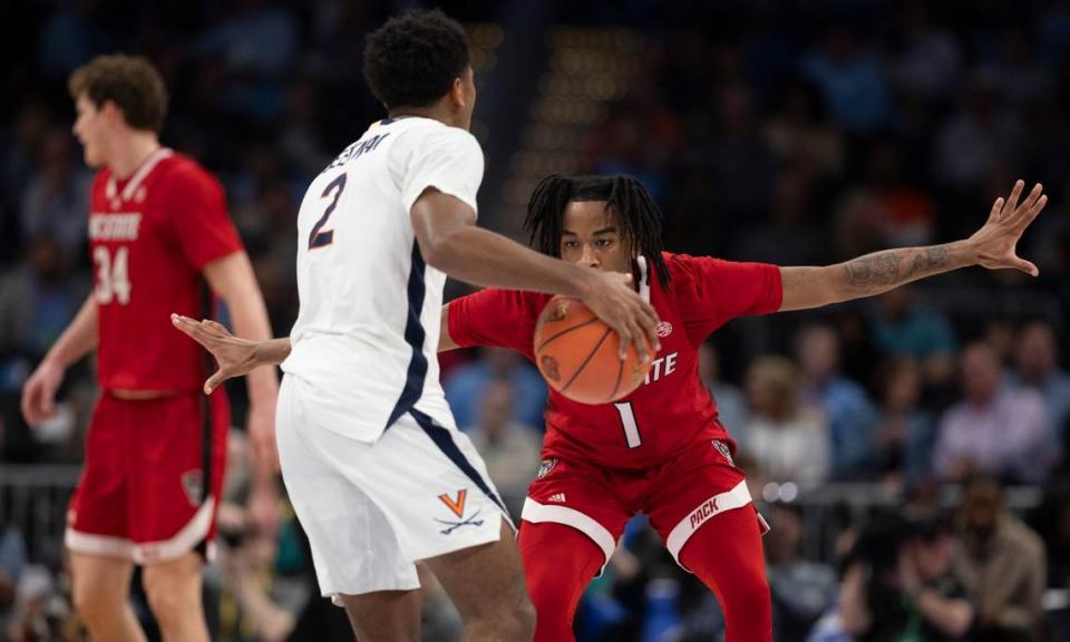 N.C. State’s Jayden Taylor (1) defends Virginia’s Dante Harris (1) in the first half during the semi-finals of the ACC Men’s Basketball Tournament at Capitol One Arena on Friday, March 15, 2024 in Washington, D.C.