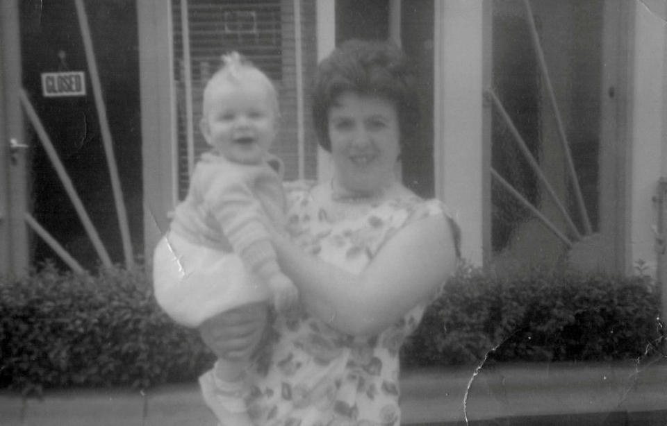 Margaret Sherlock with Adrian as a baby outside the shop in 1963. (SWNS)
