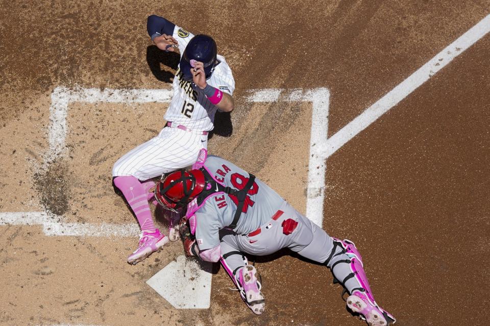 St. Louis Cardinals catcher Iván Herrera tags out Milwaukee Brewers' Rhys Hoskins at home during the first inning of a baseball game Sunday, May 12, 2024, in Milwaukee. (AP Photo/Morry Gash)