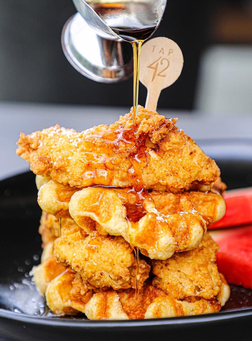 Chicken and waffles are a featured item at Tap 42, a restaurant that will open during 2023 at The Gardens Mall in Palm Beach Gardens.