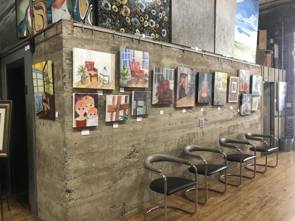 Artwork from Washburn Rural and Seaman middle and high school students are displayed prominently. The pieces are available for sale.