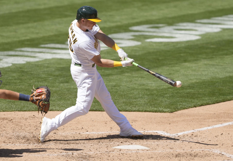 Oakland Athletics' Matt Chapman (26) hits a single to drive in a run against the Detroit Tigers during the fifth inning of a baseball game on Saturday, April 17, 2021, in Oakland, Calif. (AP Photo/Tony Avelar)