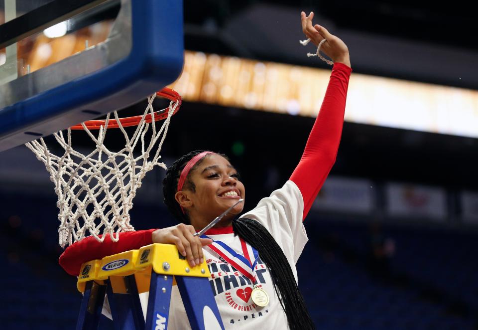 Sacred Heart’s Zakiyah Johnson celebrates her piece of the net after they beat McCracken County in the Mingua Beef Jerky Sweet 16 Girl’s Basketball Championship. 
Mar. 16, 2024