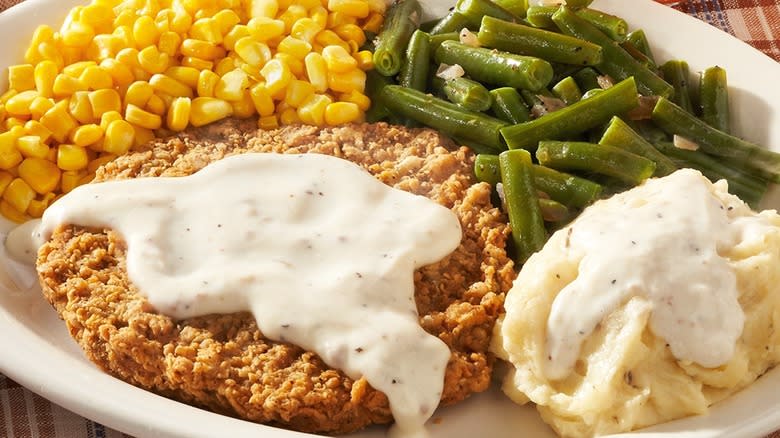country fried steak and gravy, mashed potatoes and gravy, con, green beans
