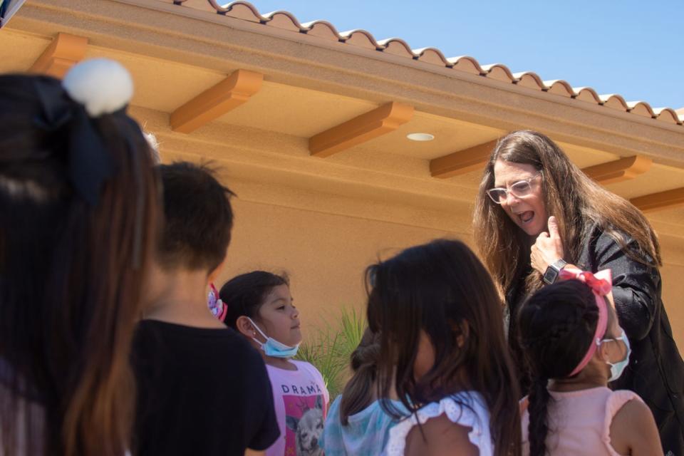 Incoming Desert Sands Unified superintendent Kelly May-Vollmar interacts with young students at the district office in La Quinta, Calif., on June 30, 2022.