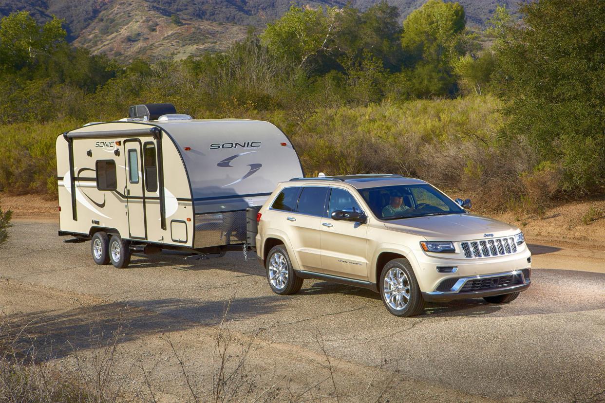 Jeep towing a travel trailer