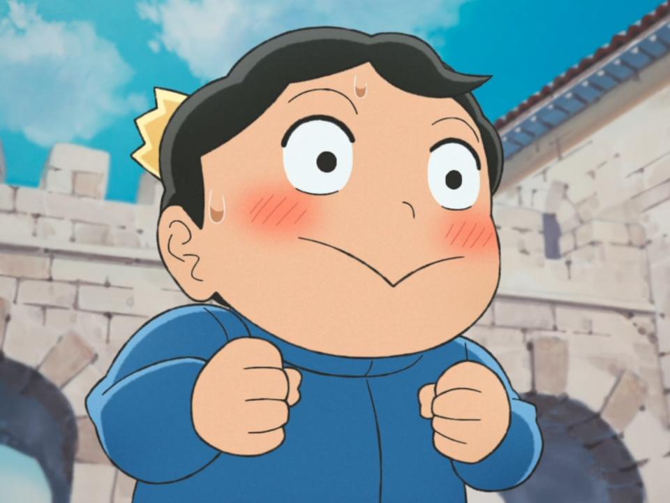 a small, animated boy with a pointed mouth and extremely excited expression on his face. there's a tiny crown resting on his head and a blushed, excited expression on his face as his hands are balled into fists in front of him